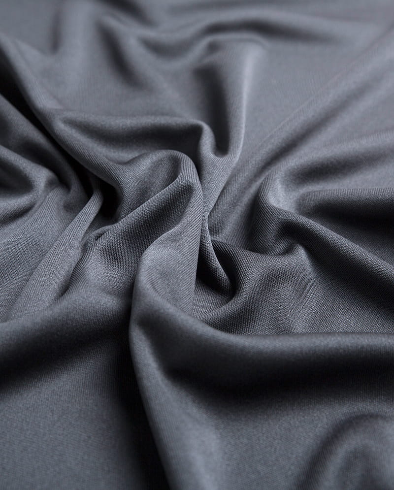 Stretch och elasticitet hos stickade tyger: Varför är de lämpliga för sportkläder och aktiva kläder?